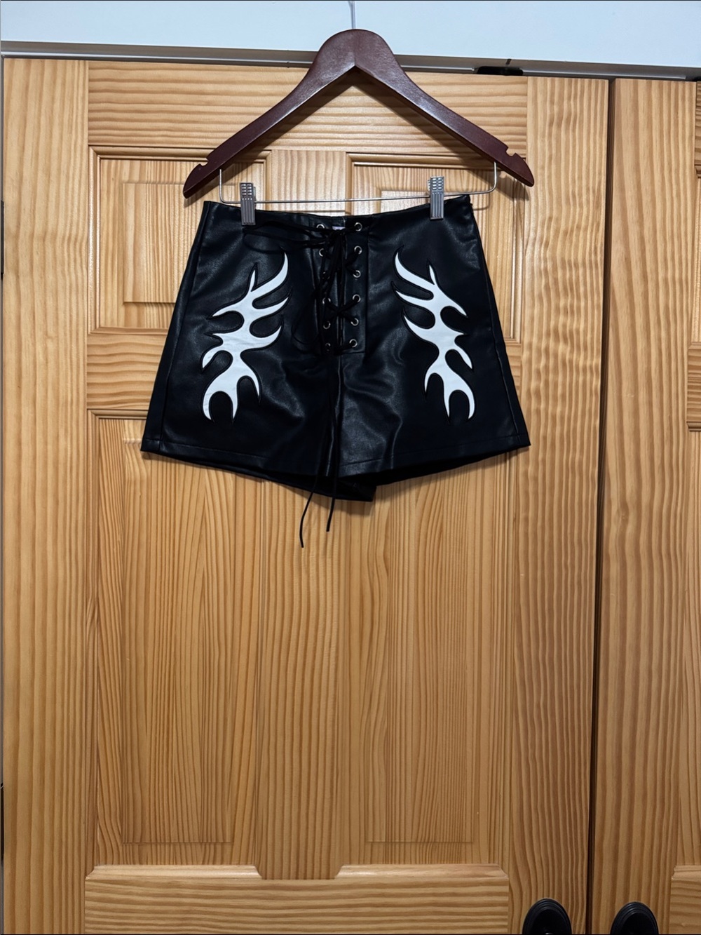 Black Faux Leather Lace-Up Shorts with White Flame Design
